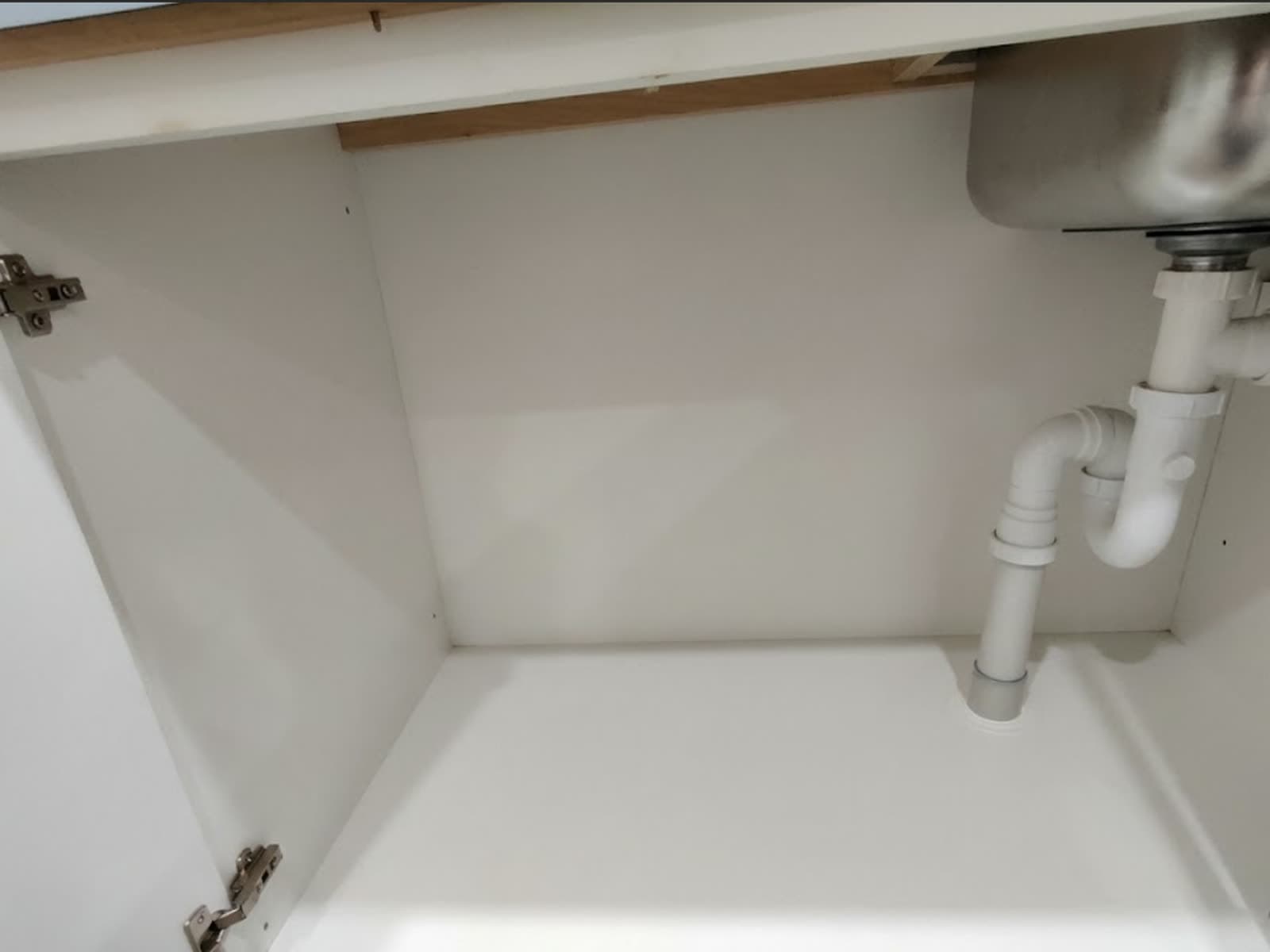 The same cabinet base, clean and white after cleaning