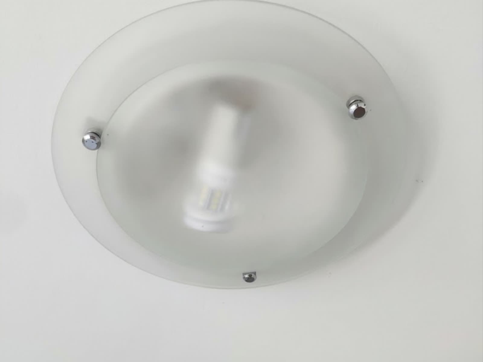 The same ceiling light, clear and clean after cleaning